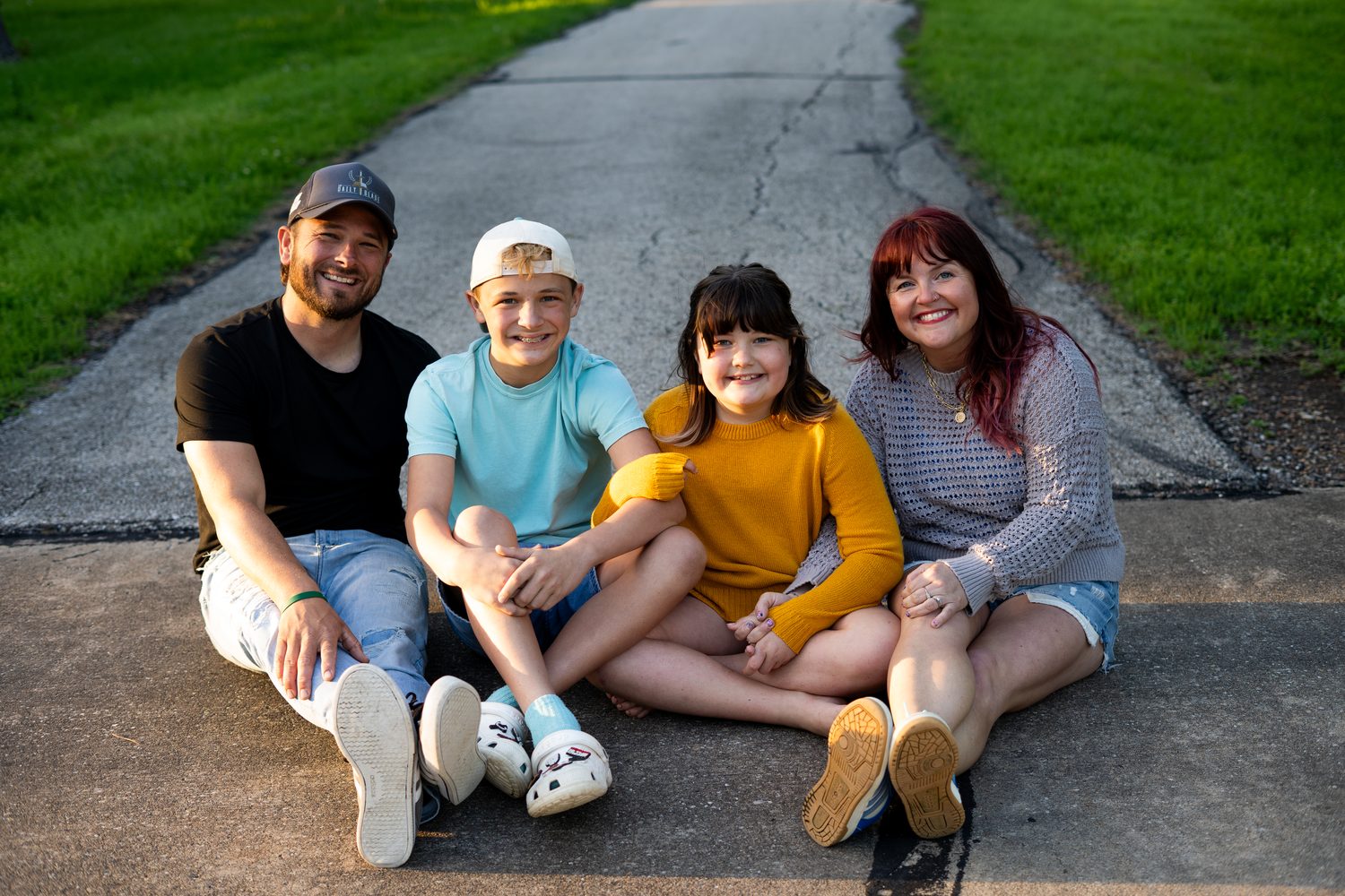 The Stand Firm Services family sitting together outdoors
